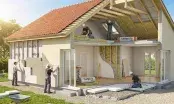 Travaux d’isolation de combles avec ouate de cellulose dans une charpente de maison