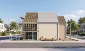 Maison individuelle en cours de rénovation, charpente à nu sur une travée, échafaudage en façade et couverture neuve