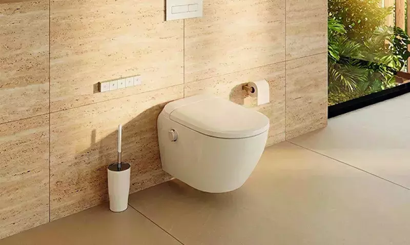 WC lavant-séchant Saniwash avec télécommande, siège chauffant et design moderne en salle de bain
